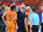 Netherlands head coach Ronald Koeman speaks with referee Anthony Taylor on June 21, 2024 (IMAGO)