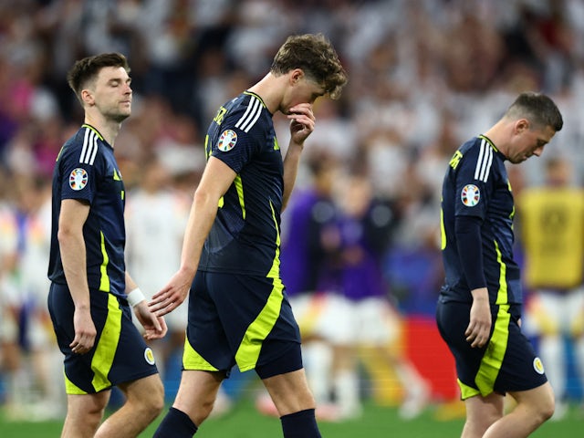 Scotland's Kieran Tierney and Jack Hendry look dejected after the match on June 14, 2024