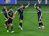 Scotland's Scott McTominay celebrates scoring their first goal with Billy Gilmour on June 19, 2024