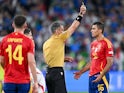 Spain's Rodri is given a yellow card by referee Slavko Vincic in June 2024 [IMAGO]