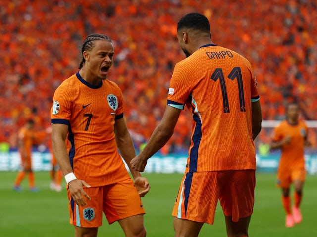 Netherlands' Cody Gakpo celebrates scoring their first goal with Xavi Simons on June 25, 2024