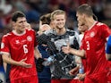 Andreas Kristiansen, Morten Hjulmand and Jannik Vestergaard of Denmark celebrate after the UEFA EURO on June 24, 2024