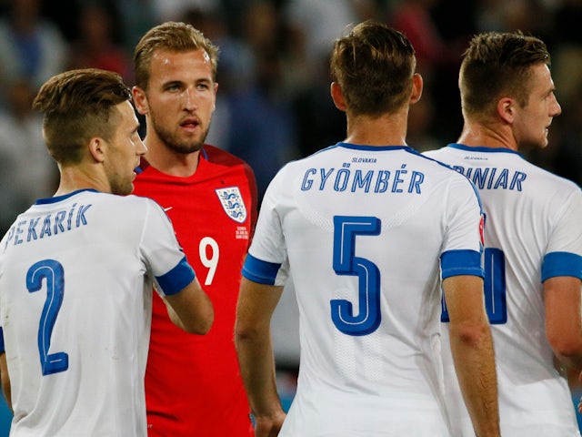 England's Harry Kane with Slovakia's Peter Pekarik and Norbert Gyomber at the end of the game on June 20, 2016