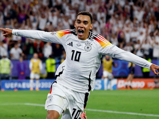 Jamal Musiala celebrates scoring for Germany on June 29, 2024