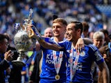 Harry Winks and Kiernan Dewsbury-Hall of Leicester hold the trophy  on June 26, 2024