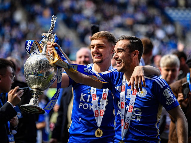 Harry Winks and Kiernan Dewsbury-Hall of Leicester hold the trophy  on June 26, 2024