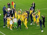  Romania players celebrate after the match on June 26, 2024