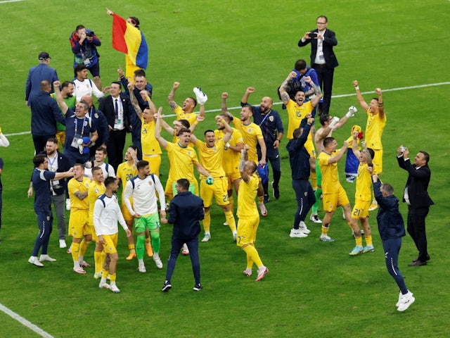  Romania players celebrate after the match on June 26, 2024