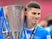 Peterborough United's Ronnie Edwards with the EFL Trophy on April 7, 2024 [IMAGO]