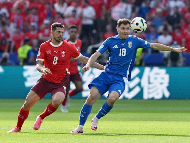 Italy's Nicolo Barella in action with Switzerland's Remo Freuler on June 29, 2024