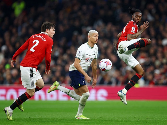 Tottenham Hotspur's Richarlison in action with Manchester United's Victor Lindelof and Aaron Wan-Bissaka on April 23, 2023