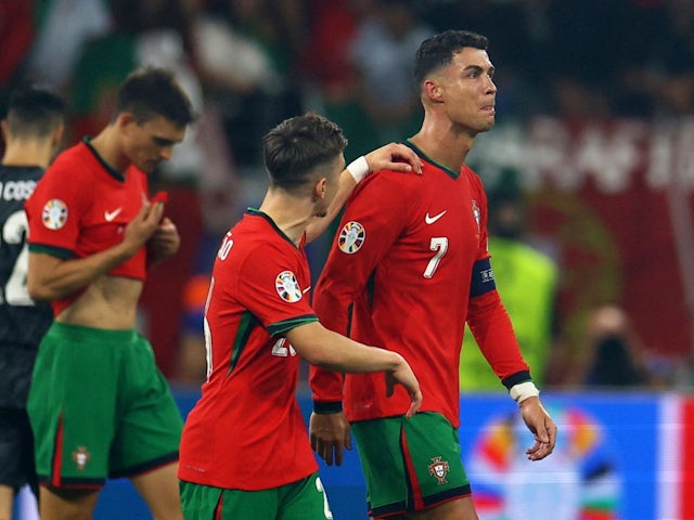 Portugal's Francisco Conceicao consoles Cristiano Ronaldo on July 1, 2024
