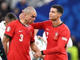  Pepe and Cristiano Ronaldo look dejected after the match on July 5, 2024