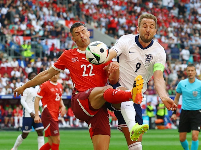 England's Harry Kane in action with Switzerland's Fabian Schar on July 6, 2024
