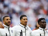 England's Kyle Walker, Jude Bellingham and Bukayo Saka line up during the national anthems before the match on June 30, 2024