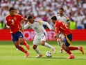 Spain's Rodri and Dani Carvajal in action with Germany's Jamal Musiala on July 5, 2024