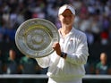 Barbora Krejcikova poses with the Venus Rosewater Dish after winning the Wimbledon title on July 13, 2024