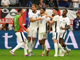 England's Jude Bellingham celebrates scoring their first goal with Harry Kane, Declan Rice and Ivan Toney on July 12, 2024