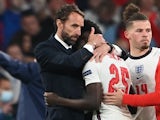England manager Gareth Southgate and Bukayo Saka look dejected after losing the Euro 2020 final