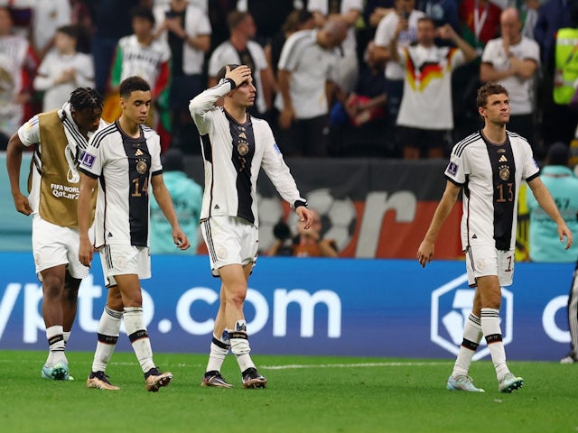 Germany's Jamal Musiala, Kai Havertz and Thomas Muller look dejected after the match as Germany are eliminated from the World Cup in 2022