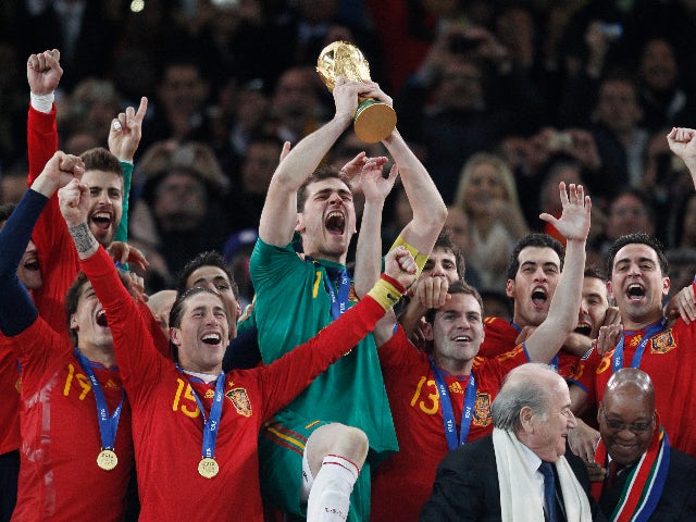 Spain's Iker Casillas holds aloft the World Cup trophy as he celebrates with team mates after victory in the final