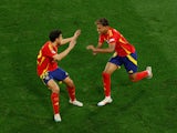 Spain's Lamine Yamal celebrates scoring their first goal with Jesus Navas on July 9, 2024