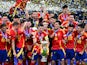 Spain's Alvaro Morata lifts the trophy as he celebrates with teammates after winning Euro 2024 on July 14, 2024