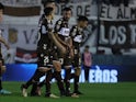 Platense players look on in 2024