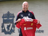 Liverpool manager Arne Slot poses with the club shirt outside the training centre on July 5, 2024