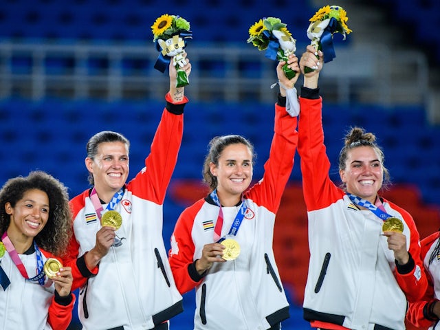 Canada's Christine Sinclair and teammates celebrate with their gold medals at the Tokyo 2020 Olympics on August 6, 2021