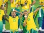 Brazil's Dani Alves and Richarlison celebrate with their gold medals at the Tokyo 2020 Olympics on August 7, 2021