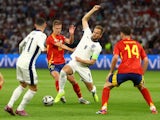 England's Harry Kane in action with Spain's Dani Olmo on July 14, 2024
