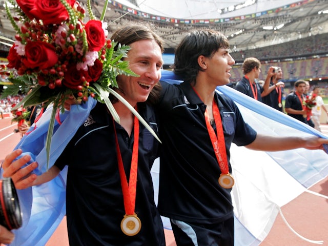 Argentina's Lionel Messi and Sergio Aguero celebrate with their gold medals at the Beijing 2008 Olympics on August 23, 2008