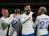 France's Benjamin Pavard celebrates scoring their first goal with Olivier Giroud and Theo Hernandez on March 27, 2023