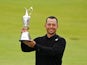 Xander Schauffele of the U.S celebrates with the Claret Jug trophy after winning The 152nd Open Championship on July 21, 2024