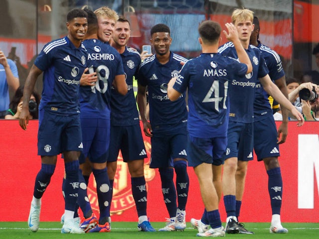 Manchester United players celebrate Erling Haaland's goal against Arsenal on July 27, 2024