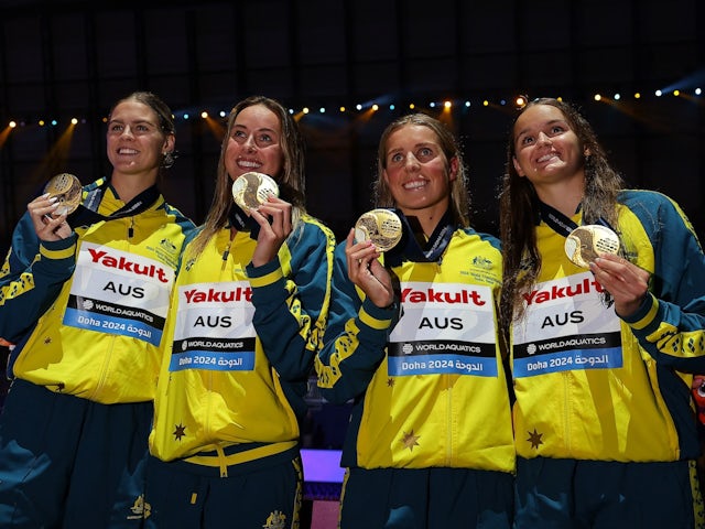 Australia's Iona Anderson, Abbey Harkin, Brianna Throssell and Shayna Jack celebrate on the podium with gold medals after winning the women's 4x100m medley relay final on July 27, 2024