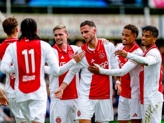 Ajax's Branco van den Boomen celebrates with teammates on July 13, 2024