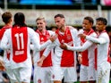 Ajax's Branco van den Boomen celebrates with teammates on July 13, 2024