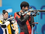 Huang Yuting (L)/Sheng Lihao of China compete during the 10m air rifle mixed team gold medal match of shooting between China and South Korea at the Paris 2024 Olympic Games on July 27, 2024