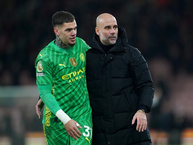 Manchester City's Ederson and Pep Guardiola pictured on July 24, 2024