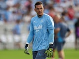 Manchester City goalkeeper Ederson warming up before the match on July 23, 2024
