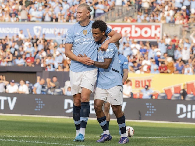 Manchester City's Erling Haaland and Oscar Bobb against AC Milan on July 27, 2024