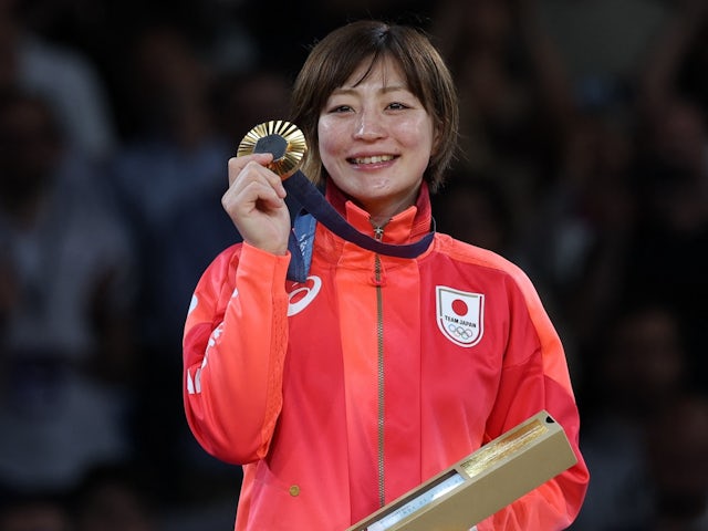 Gold medalist Natsumi Tsunoda of Japan poses for pictures on the podium on July 27, 2024