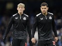 Anthony Gordon of Newcastle United and Bruno Guimaraes of Newcastle United warm up during the The FA Cup match at the Etihad Stadium on July 27, 2024