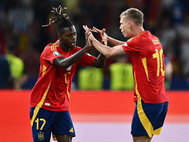 Spain's Nico Williams celebrates scoring with Dani Olmo on July 14, 2024