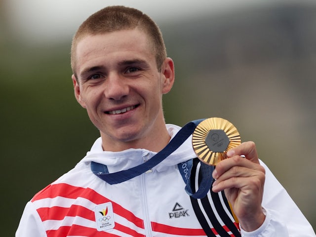 Gold medalist Remco Evenepoel of Belgium reacts on the podium on July 27, 2024