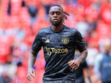 Manchester United right-back Aaron Wan-Bissaka warms up in May 2024