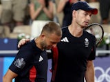 Andy Murray of Britain and Daniel Evans of Britain react after losing their match against Taylor Fritz of United States and Tommy Paul of United States on August 1, 2024