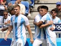 Thiago Almada of Argentina celebrates scoring their first goal with teammates at the Olympic Games on July 27, 2024